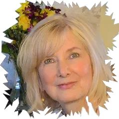 Portrait of author Candia Lea Cole with blonde hair against a backdrop of colorful flowers.