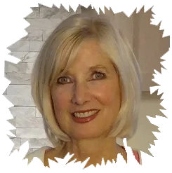 Close-up portrait of a smiling woman with short blonde hair featuring jagged torn-paper edges.